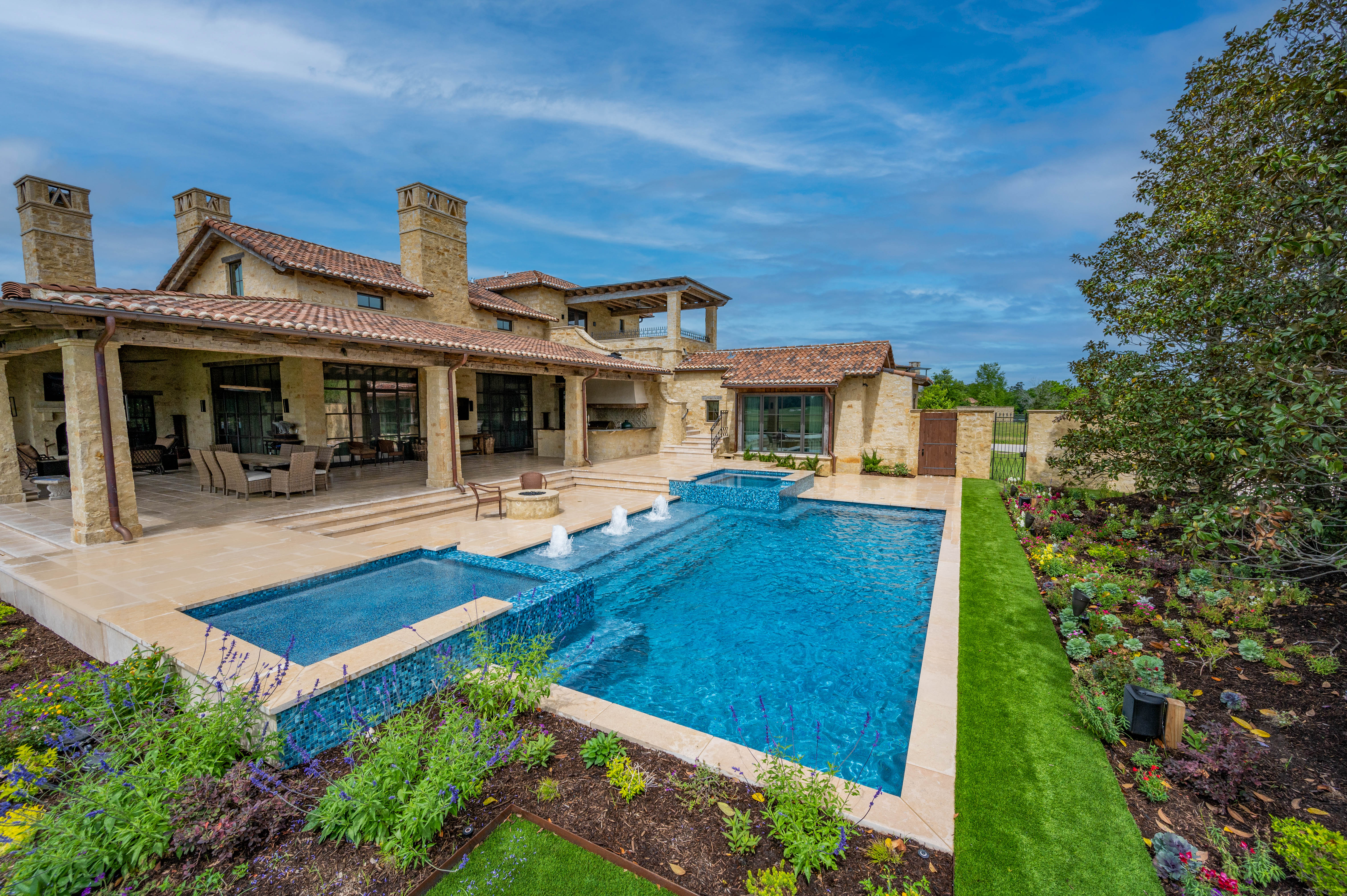 Luxury Texas pool integrated with outdoor living and entertainment areas