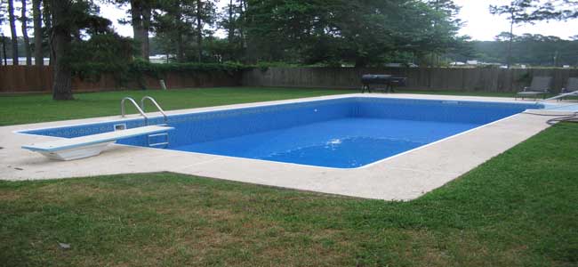 Vinyl liner swimming pool with vibrant pattern in a Spring, Texas backyard.
