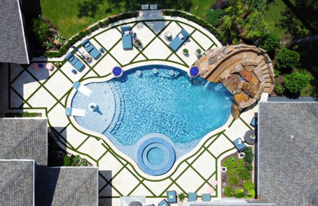 Luxury custom pool designed for a Texas home with integrated outdoor living